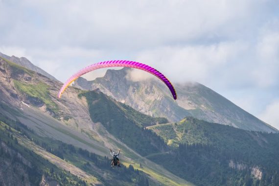 Experience thrilling paragliding over stunning mountain landscapes, perfect for adventure seekers.